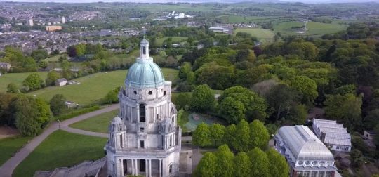 Image may contain: Land, House, Housing, Mansion, Vegetation, Castle, Grass, Plant, Steeple, Spire, Tower, Aerial View, Architecture, Building, Panoramic, Scenery, Landscape, Nature, Outdoors