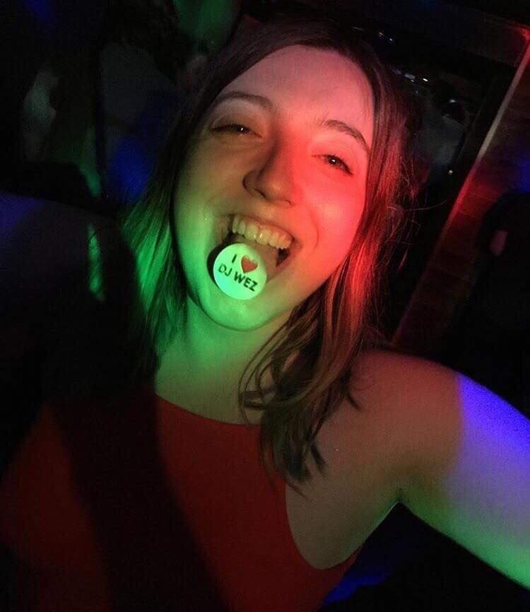 Image may contain: Light, Night Life, Night Club, Face, Club, Lighting, Teeth, Mouth, Lip, Person, Human