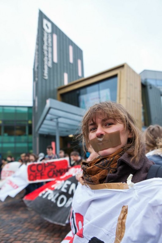Campaigners have duct-taped their faces to represent their repression