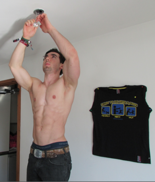 Charlie enjoys man activities like changing lightbulbs. We're saying nothing about that t-shirt