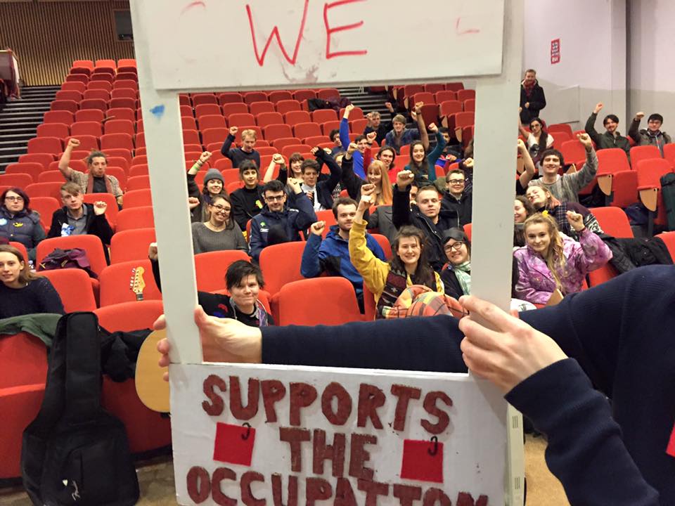 A group photograph showing occupying students in situ.