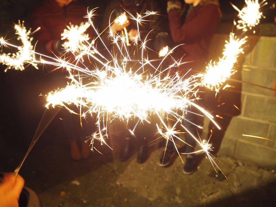 Image may contain: Night, Fireworks, Light, Flare