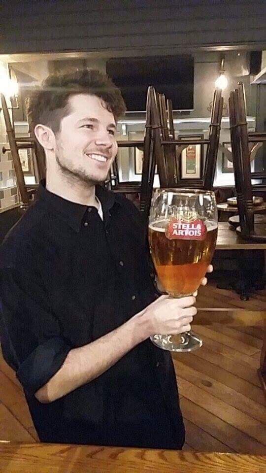 Image may contain: Glass, Beer Glass, Smile, Portrait, Face, Drink, Beverage, Beer, Alcohol, Person, People, Human