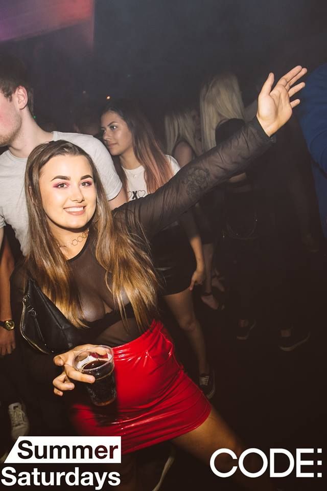 Image may contain: Party, Poster, Smile, Portrait, Face, Night Life, Night Club, Club, Person, People, Human
