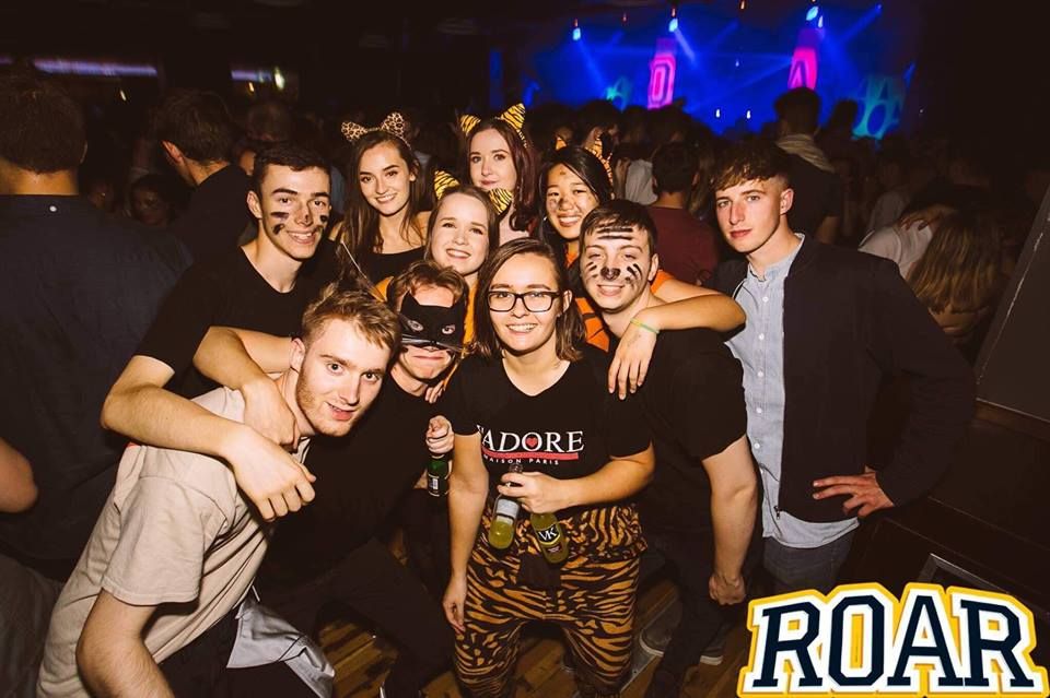 Image may contain: Crowd, Smile, Face, Night Club, Club, Night Life, Party, Human, Person