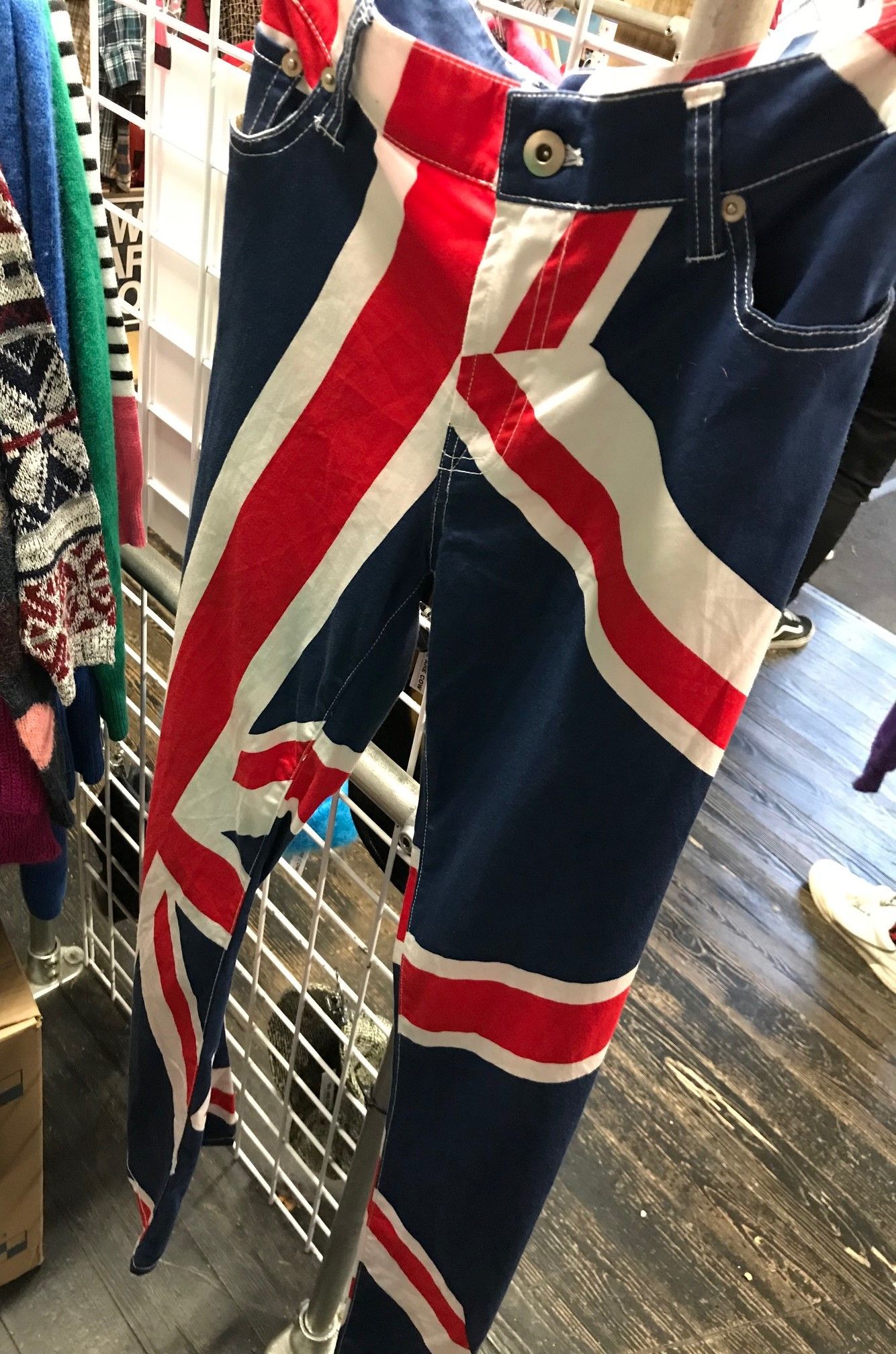 Image may contain: Shorts, Symbol, Flag, Human, Person, Furniture, Shoe, Footwear, Pants, Apparel, Clothing
