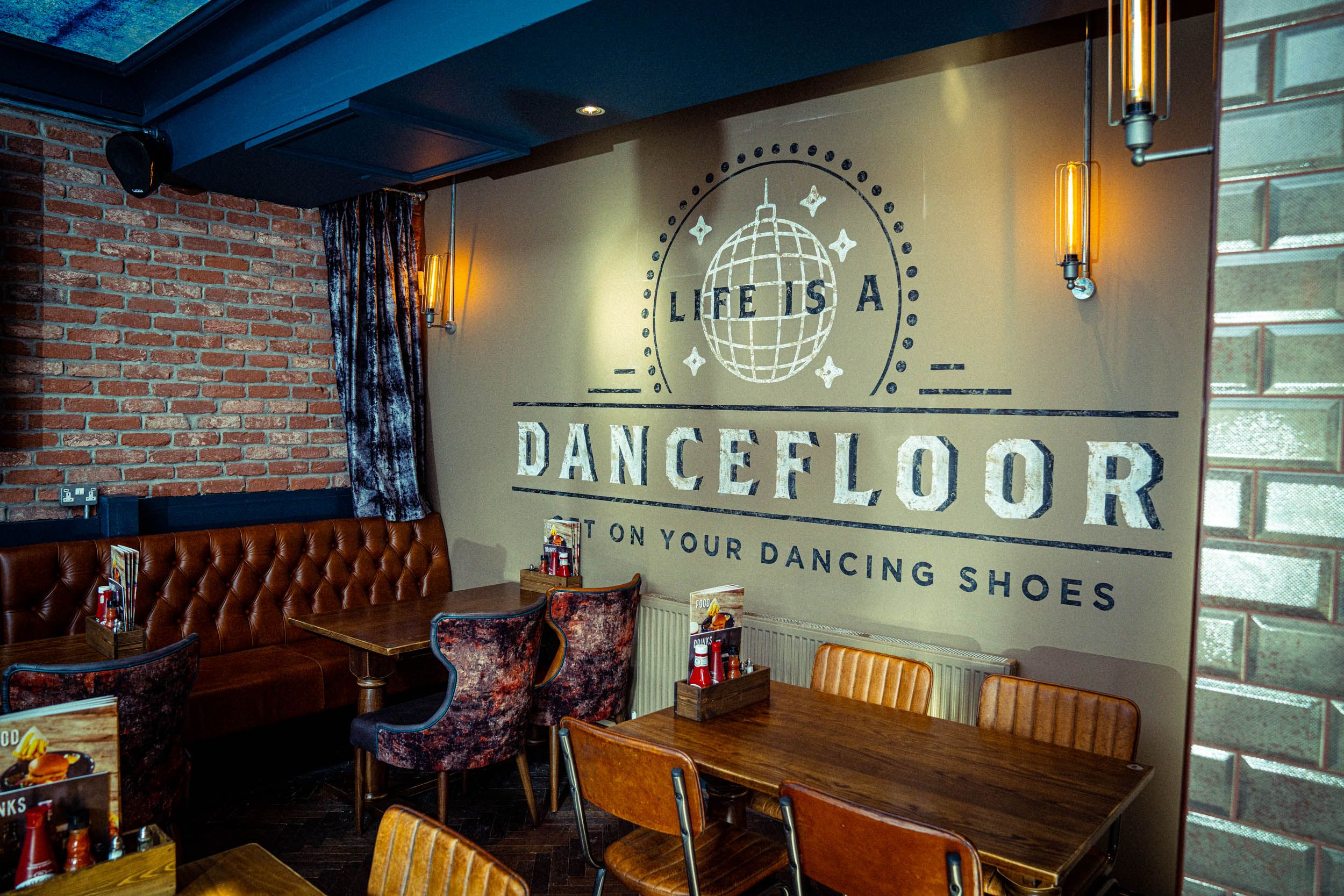 Image may contain: Floor, Clock Tower, Tower, Architecture, Building, Couch, Cafe, Cafeteria, Plywood, Furniture, Chair, Hardwood, Flooring, Restaurant, Wood