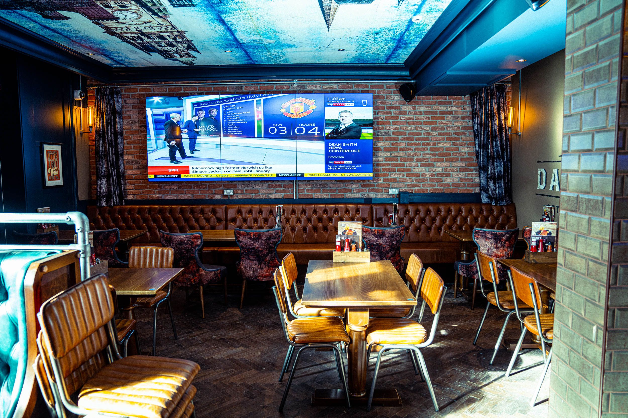 Image may contain: Food, Food Court, Pub, Monitor, Display, Electronics, Screen, Human, Person, Cafe, Cafeteria, Restaurant, Furniture, Chair