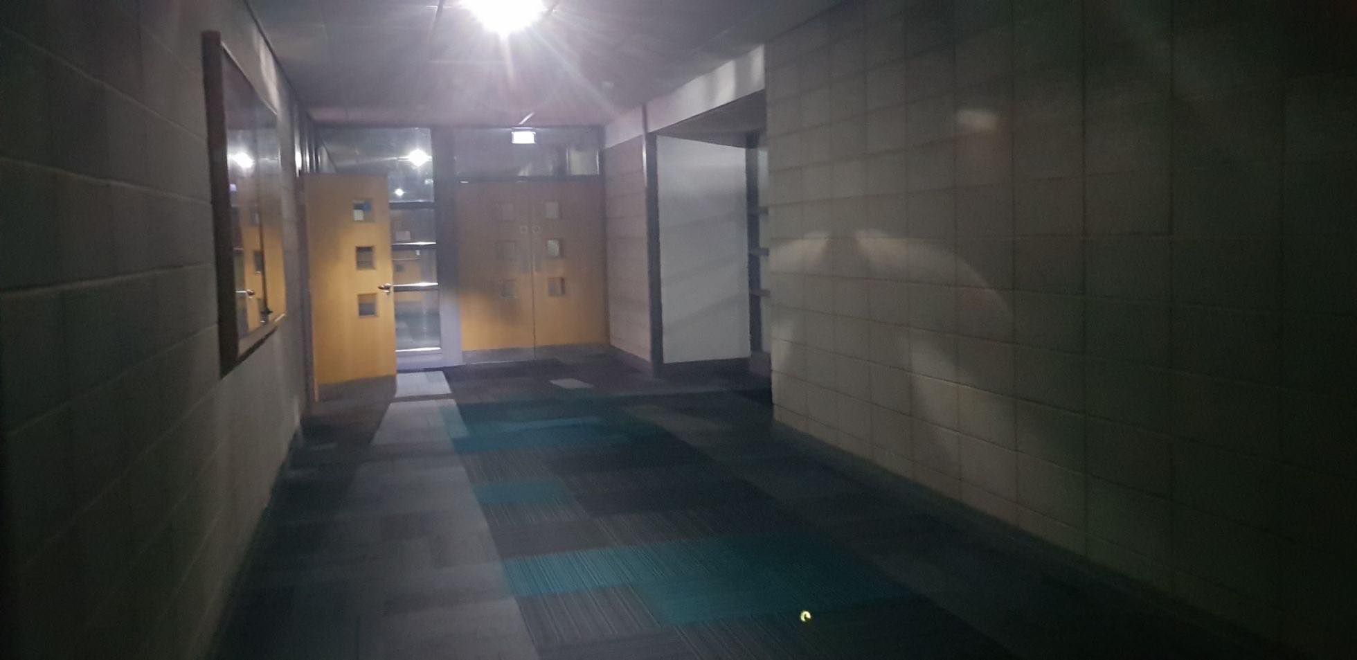 Image may contain: Indoors, Light, Flare, Corridor, Lighting, Floor, Flooring