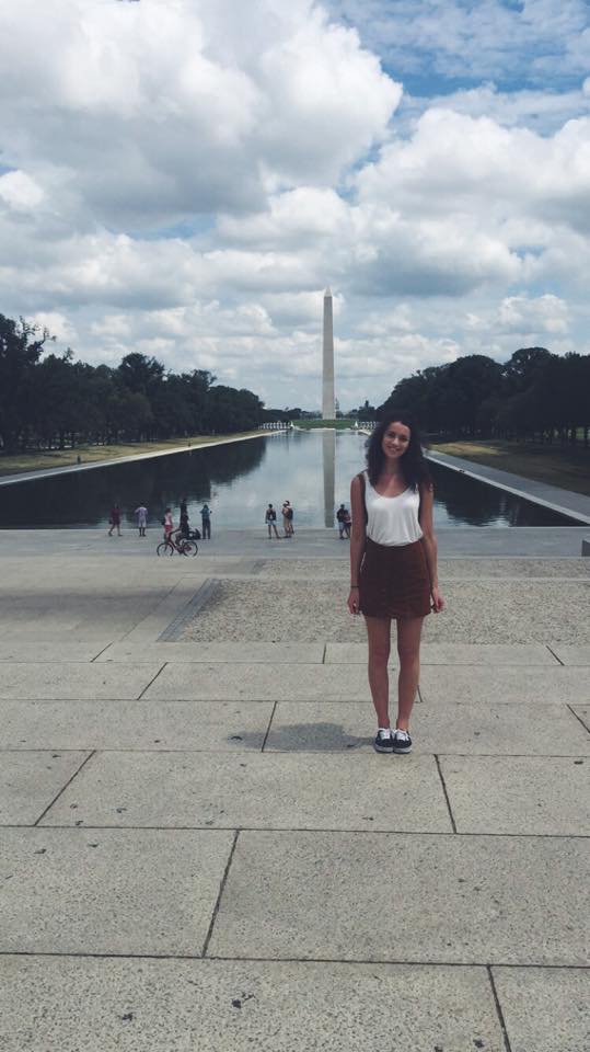 Alice posing in front of the Washington Monument.