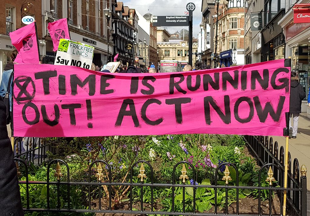 Image may contain: Crowd, Human, Person, Banner, Text