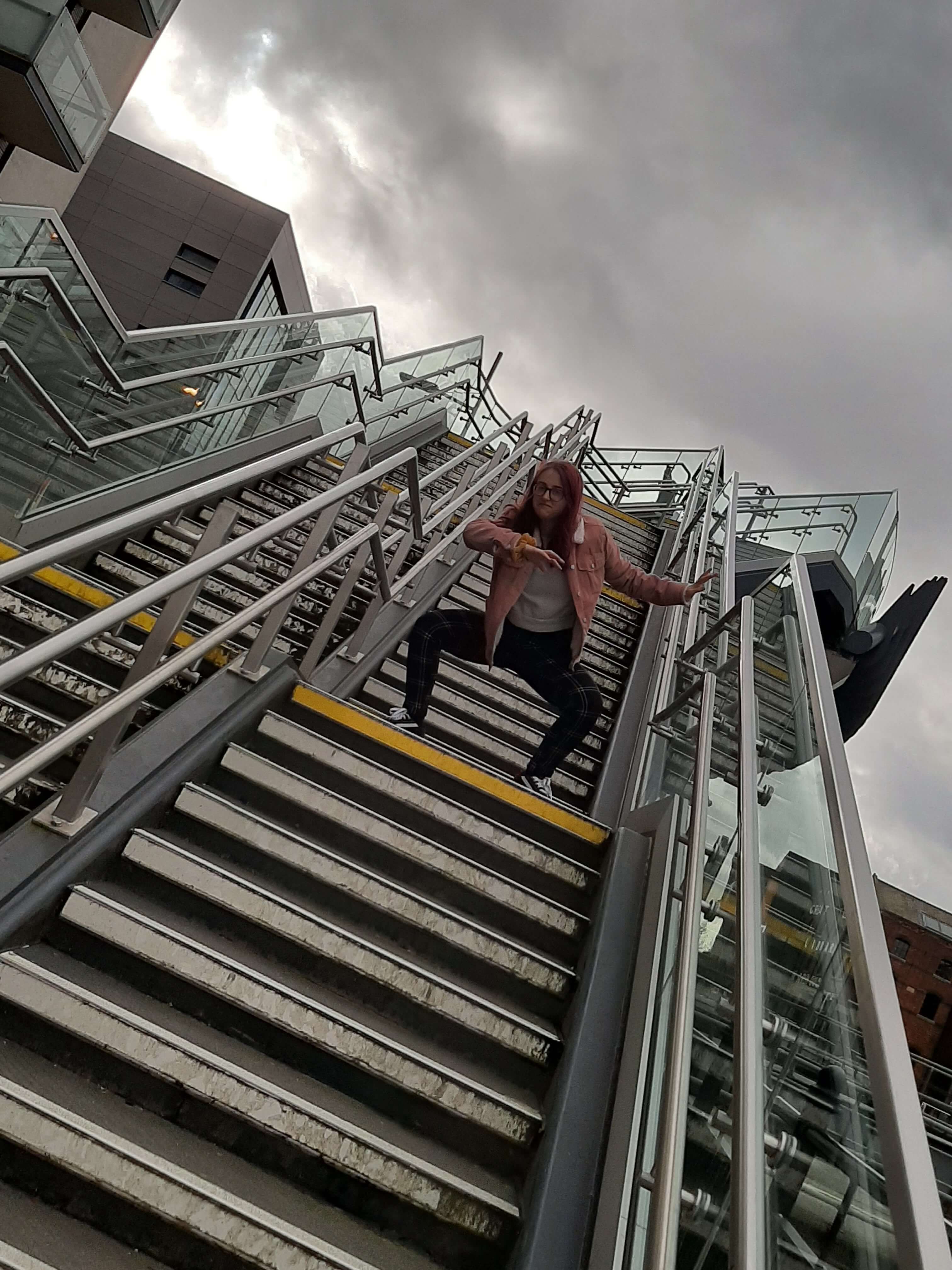 Image may contain: Staircase, Person, Human, Railing, Handrail, Banister