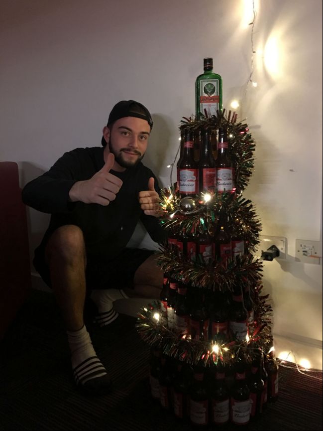 Image may contain: Drink, Bottle, Beverage, Beer Bottle, Beer, Alcohol, Vase, Pottery, Potted Plant, Plant, Jar, Flora, Person, People, Human