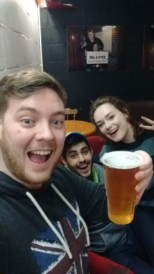 Image may contain: Glass, Beer Glass, Smile, Portrait, Face, Drink, Beverage, Beer, Alcohol, Person, People, Human