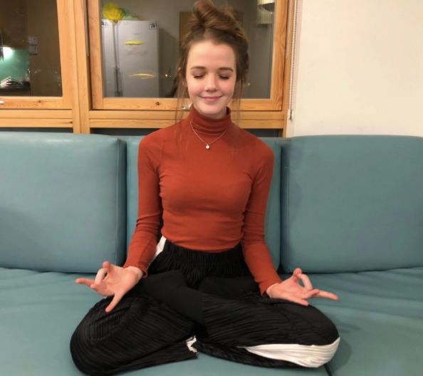 Image may contain: Yoga, Working Out, Stretch, Sports, Sport, Fitness, Exercise, Furniture, Couch, Refrigerator, Fridge, Electrical Device, Appliance, Person, People, Human