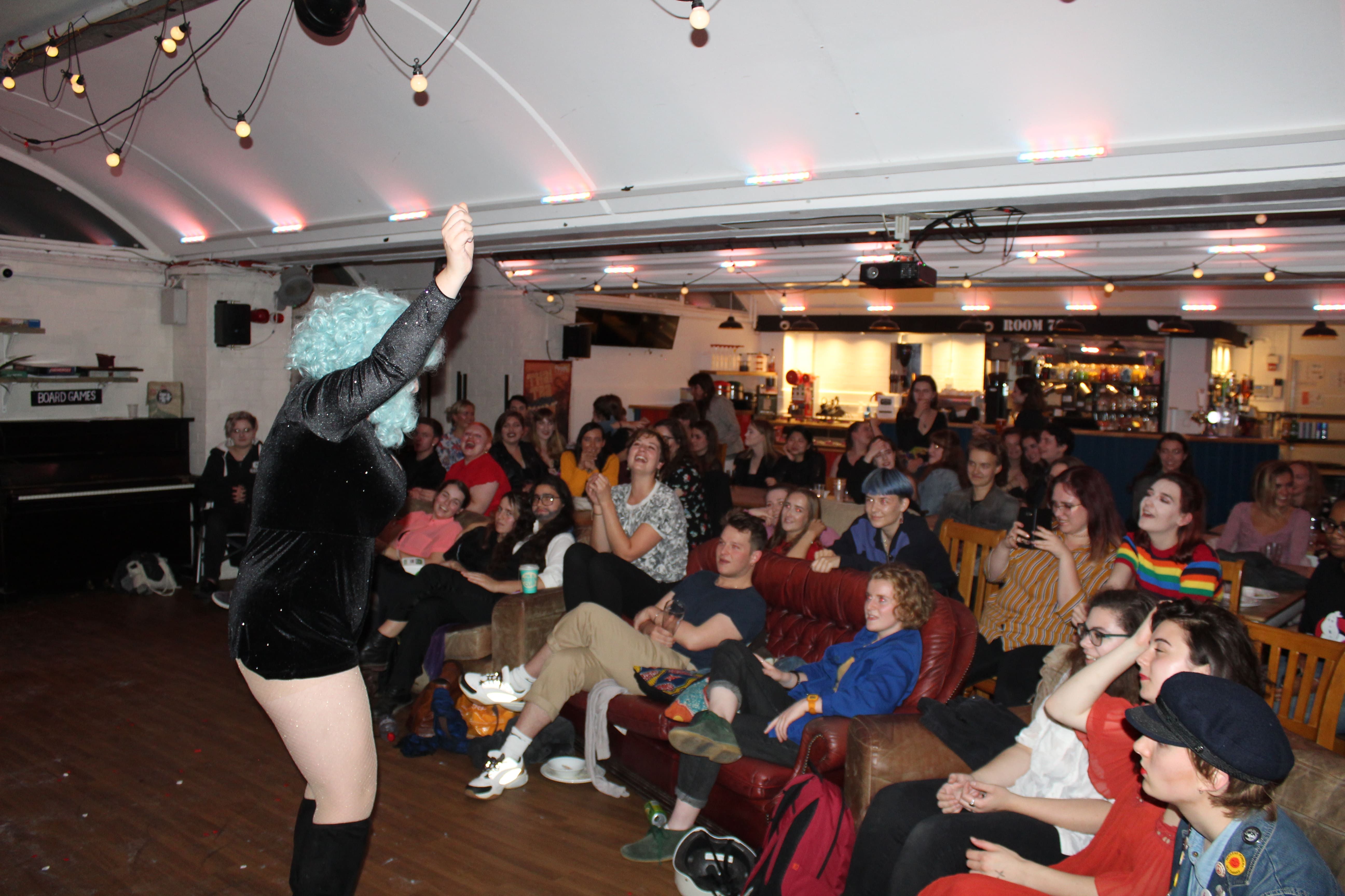 Image may contain: Crowd, Audience, Furniture, Couch, Person, People, Human