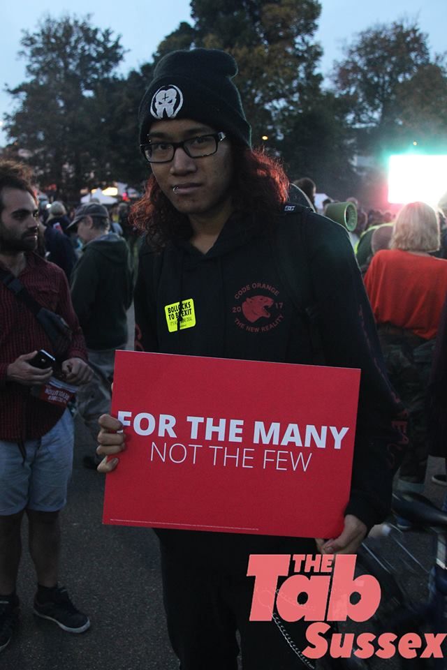 Image may contain: Sweatshirt, Sweater, Clothing, Crowd, Person, People, Human