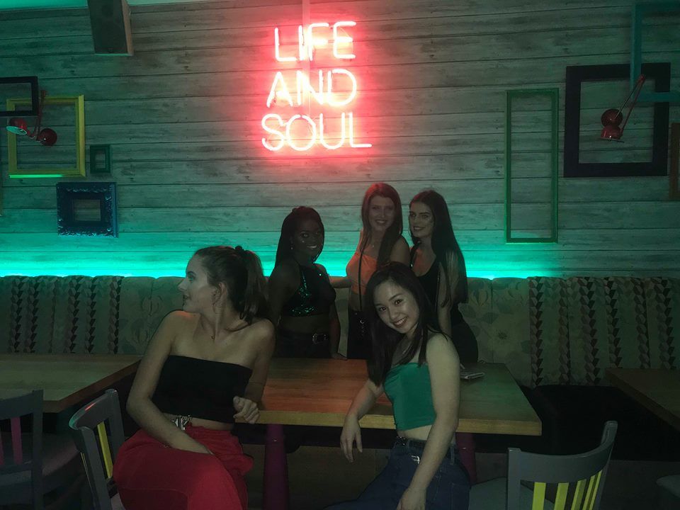 Image may contain: Light, Night Club, Club, Chair, Furniture, Human, Person