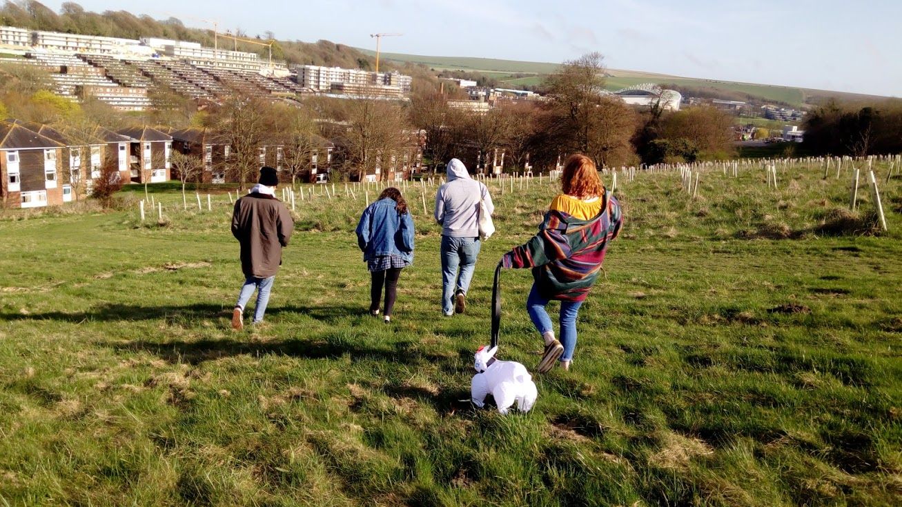 Image may contain: Walking, Countryside, Apparel, Clothing, Canine, Pet, Animal, Dog, Mammal, People, Grassland, Nature, Plant, Grass, Outdoors, Field, Human, Person