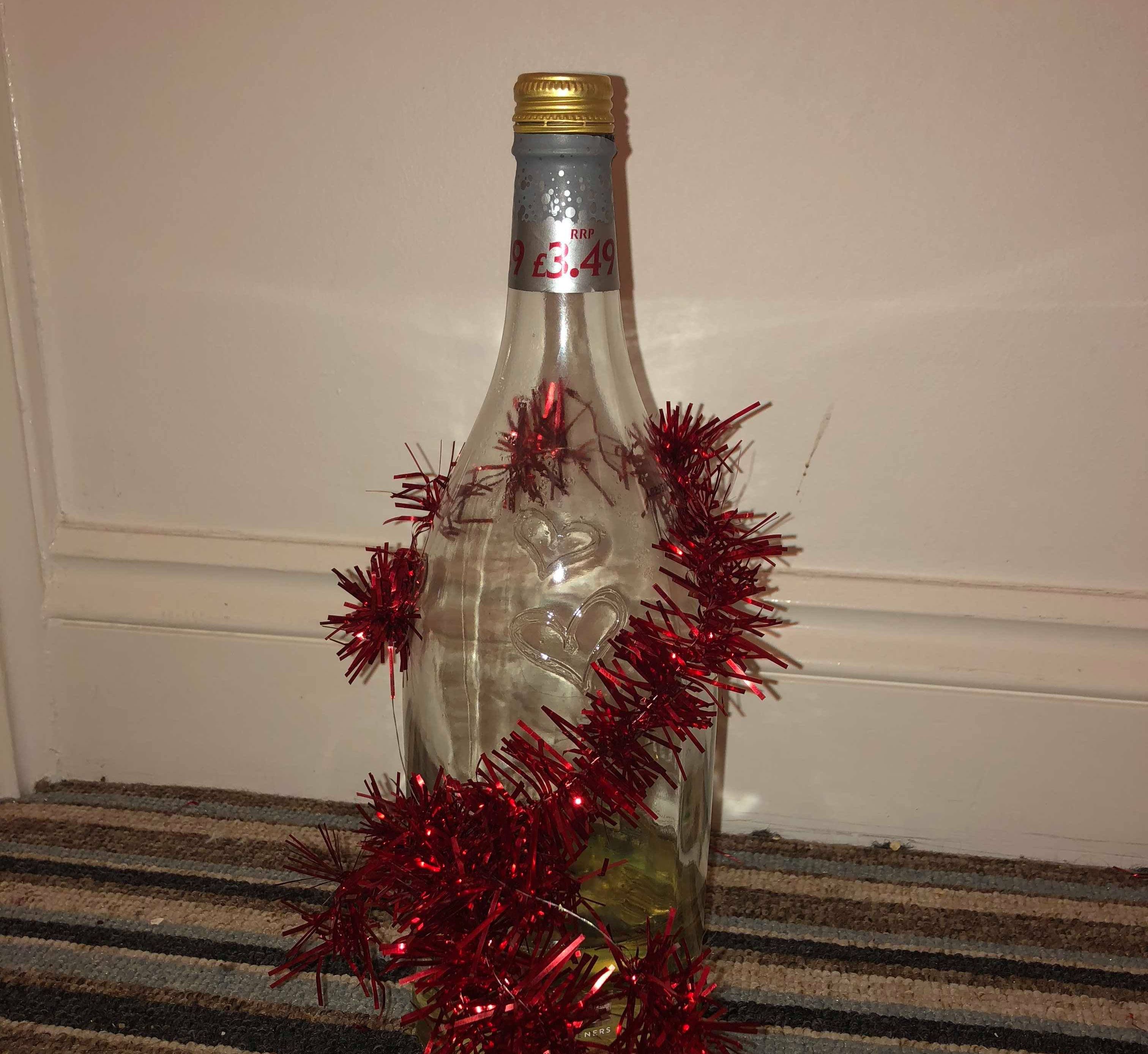Image may contain: Liquor, Bottle, Alcohol, Beverage, Drink, Tree, Plant, Ornament, Christmas Tree