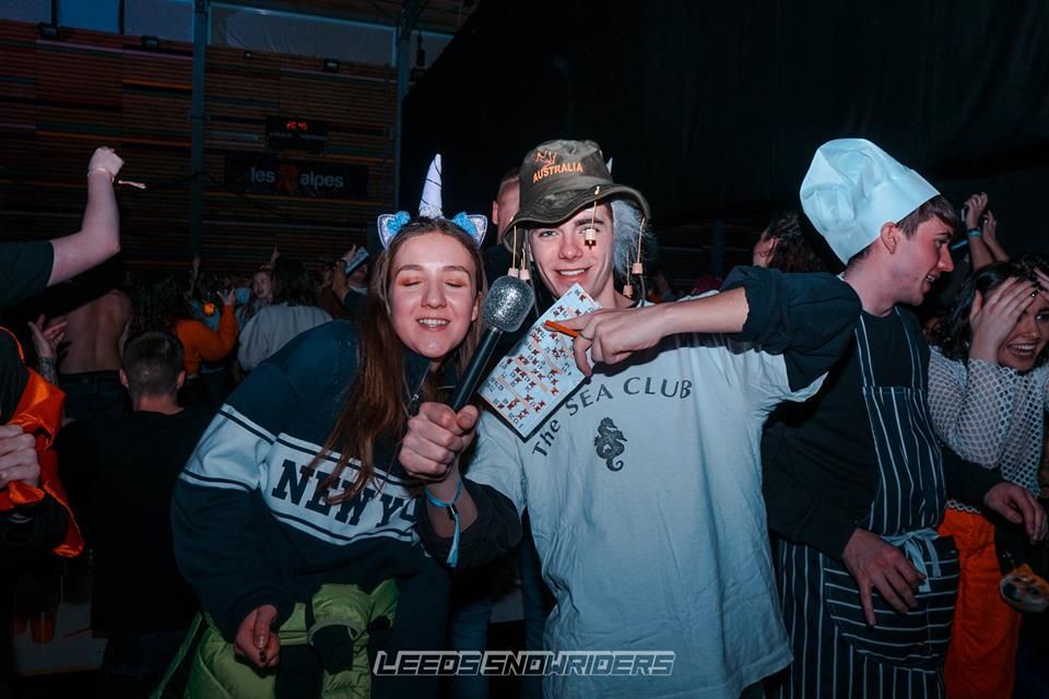 Image may contain: Crowd, Hat, People, Face, Costume, Clothing, Apparel, Party, Human, Person