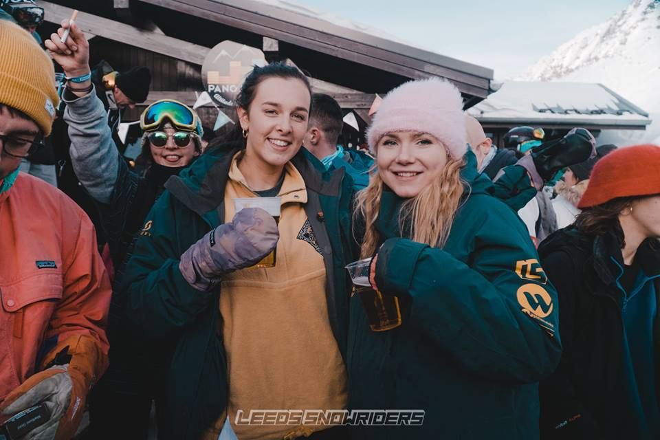 Image may contain: Goggles, Hat, Coat, People, Crowd, Face, Clothing, Apparel, Sunglasses, Accessory, Accessories, Human, Person