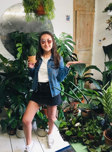 Image may contain: Girl, Vegetation, Shoe, Woman, Accessories, Accessory, Sunglasses, Footwear, Outdoors, Pants, Plant, Female, Human, Person, Apparel, Clothing