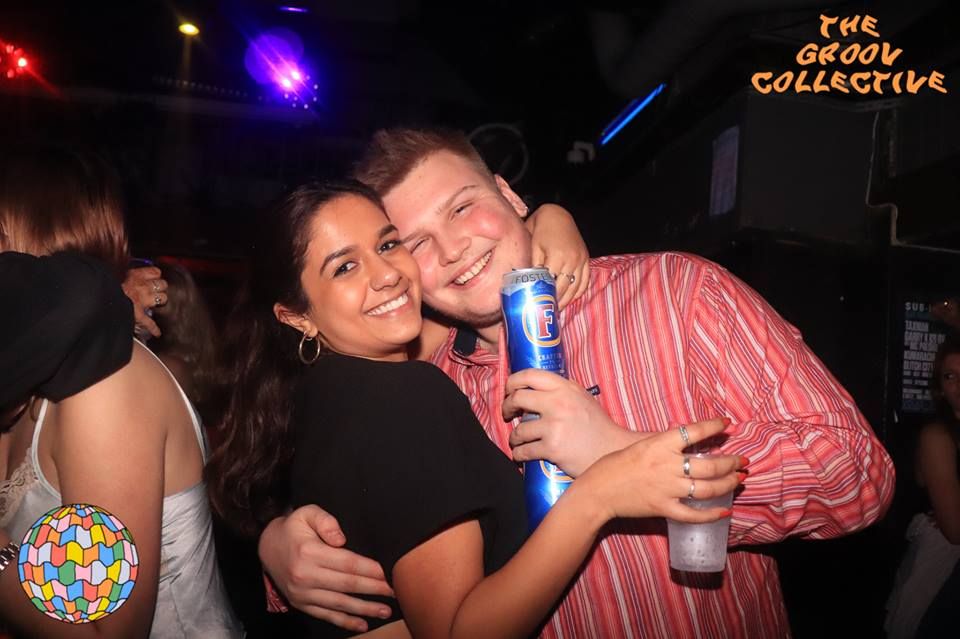 Image may contain: Night Life, Can, Club, Tin, Party, Human, Person