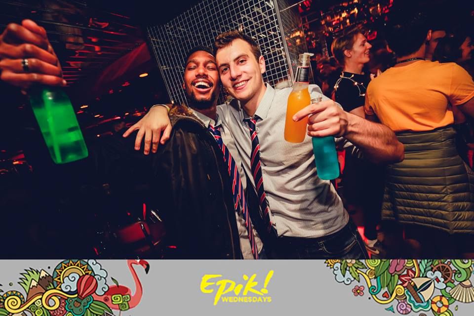 Image may contain: Apparel, Clothing, Night Life, Face, Beverage, Drink, Party, Night Club, Club, Person, Human