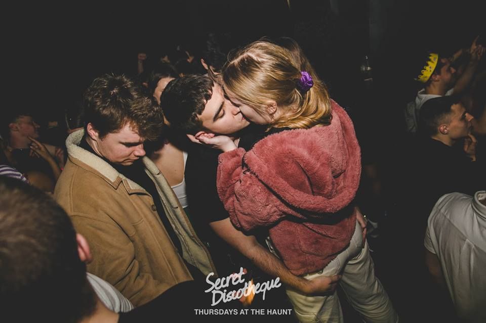Image may contain: Crowd, Dating, Hug, Person, Make Out, Human