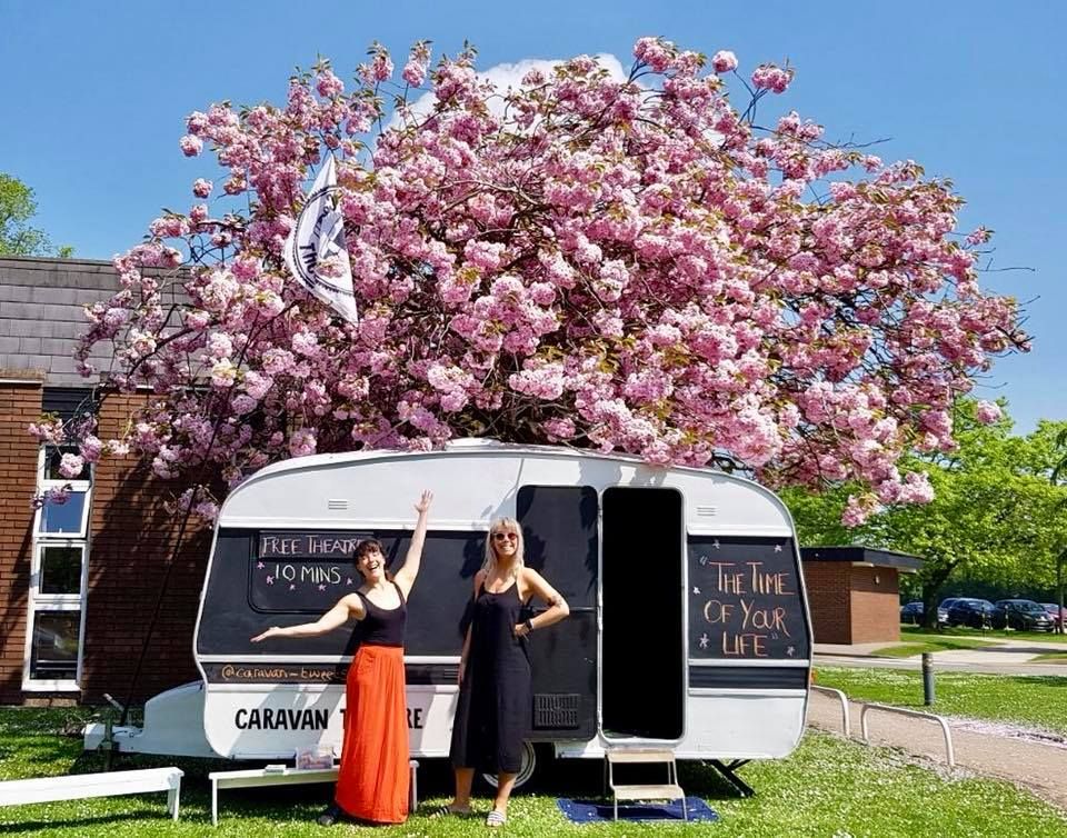 Image may contain: Female, Outdoors, Caravan, Dress, Clothing, Apparel, Van, Transportation, Vehicle, Grass, Flower, Blossom, Vegetation, Bush, Person, Human, Plant