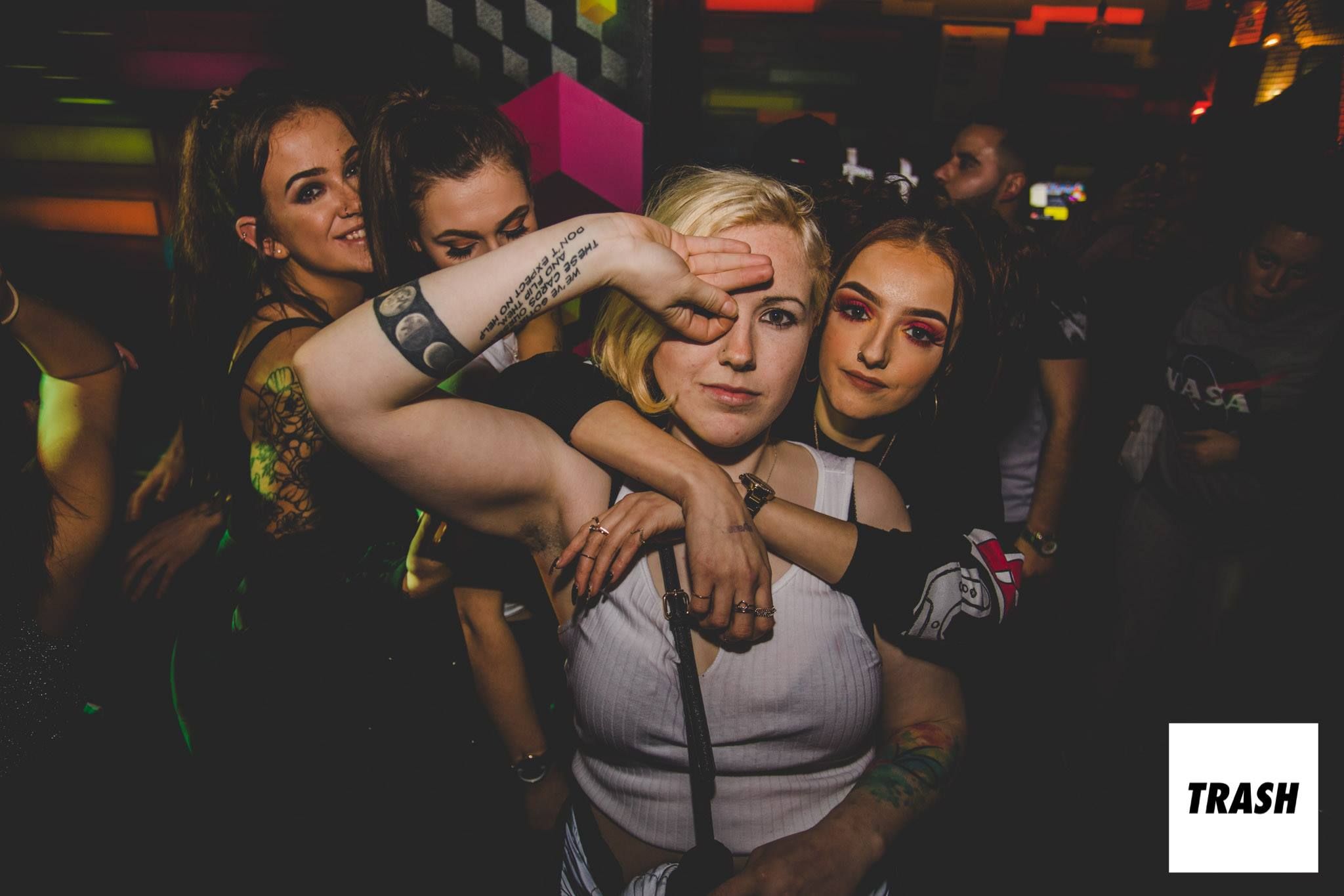 Image may contain: Night Club, Night Life, Tattoo, Club, Person, Human, Skin