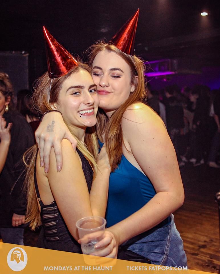 Image may contain: Night Life, Night Club, Hat, Party Hat, Party, Club, Clothing, Apparel, Human, Person