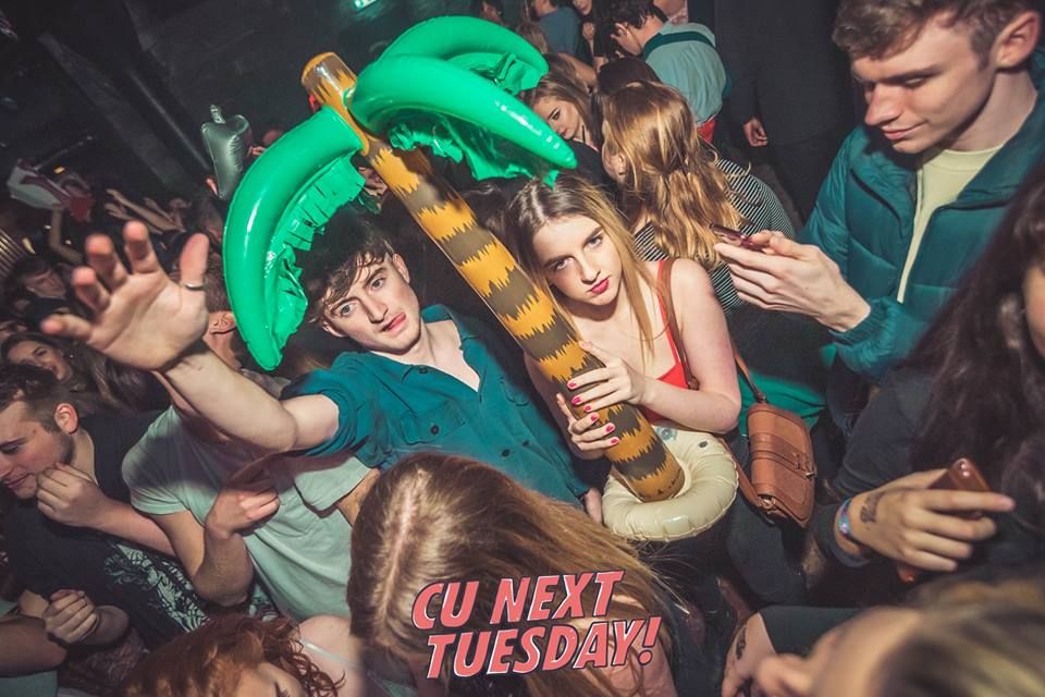 Image may contain: People, Apparel, Helmet, Clothing, Skin, Face, Night Club, Club, Party, Person, Human