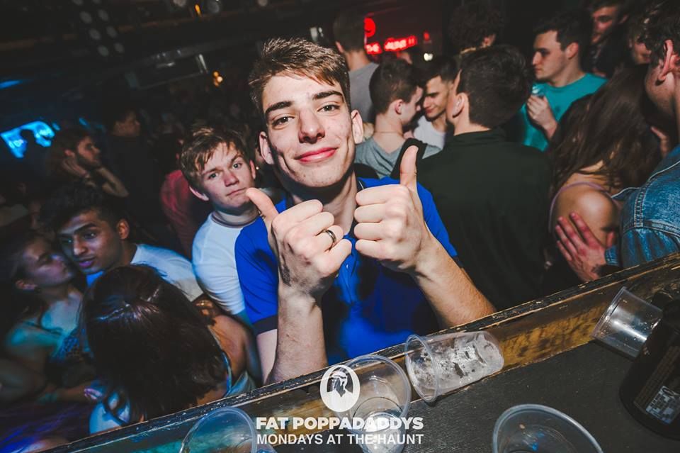 Image may contain: Finger, Audience, Crowd, Night Life, Night Club, Club, Party, Human, Person