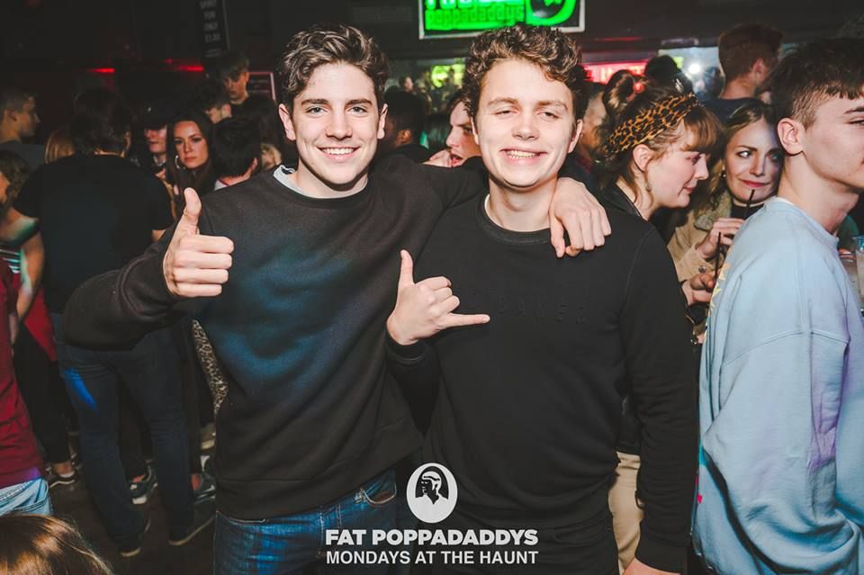 Image may contain: People, Night Club, Party, Apparel, Clothing, Club, Finger, Thumbs Up, Night Life, Person, Human