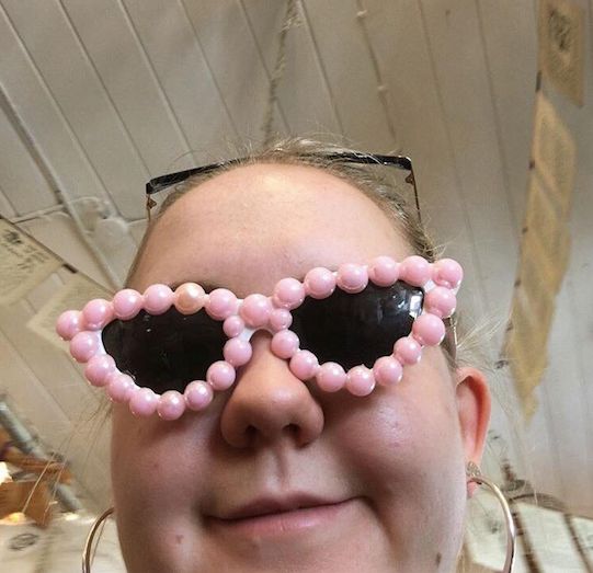 Image may contain: Portrait, Photo, Photography, Female, Glasses, Accessory, Accessories, Laughing, Mouth, Teeth, Lip, Head, Person, Human, Face, Smile