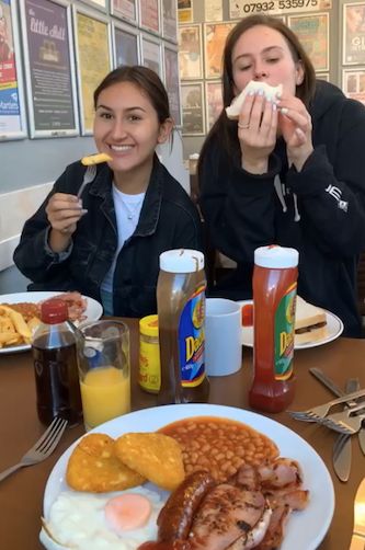 Image may contain: Cafeteria, Restaurant, Dating, Eating, Lunch, Meal, Breakfast, Food, Human, Person