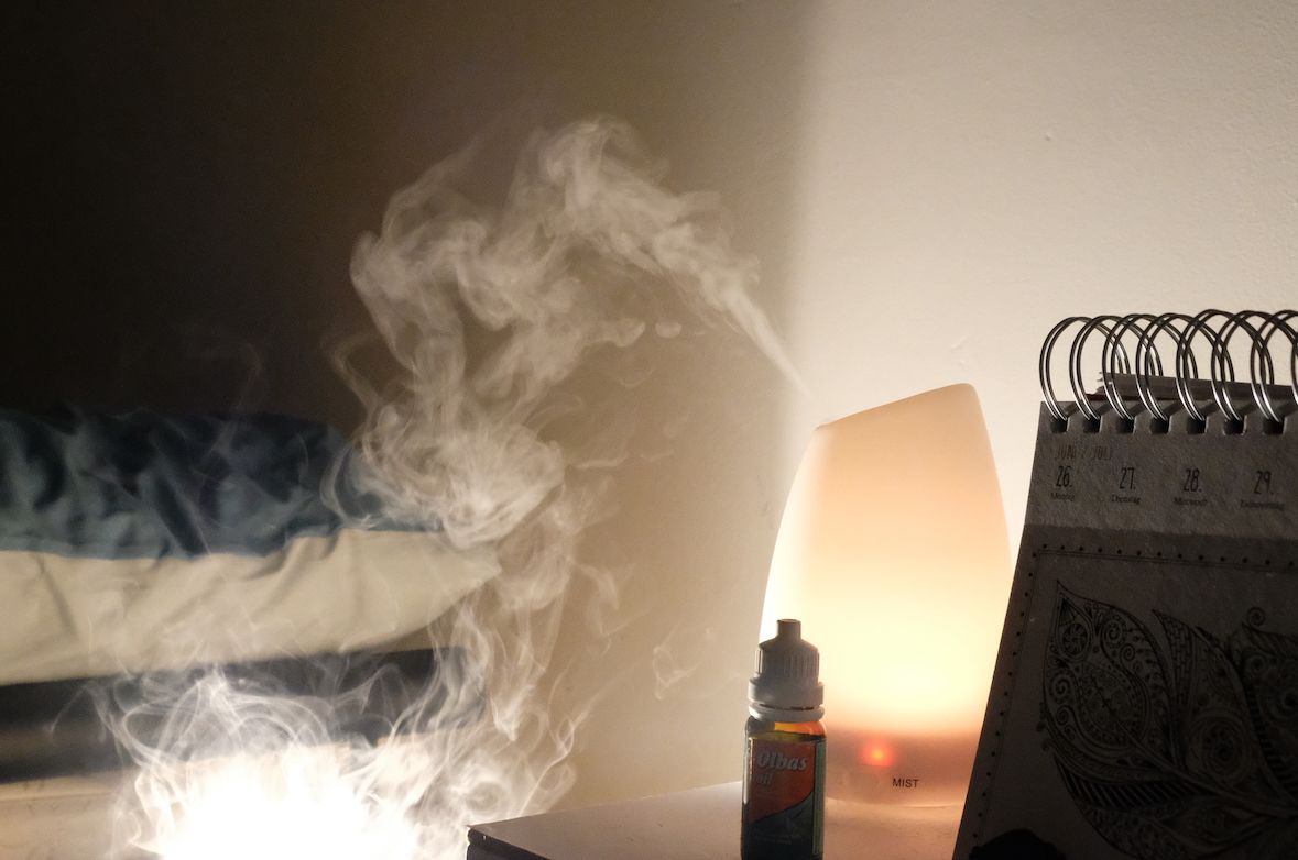 Image may contain: Lamp, Architecture, Building, Smoke