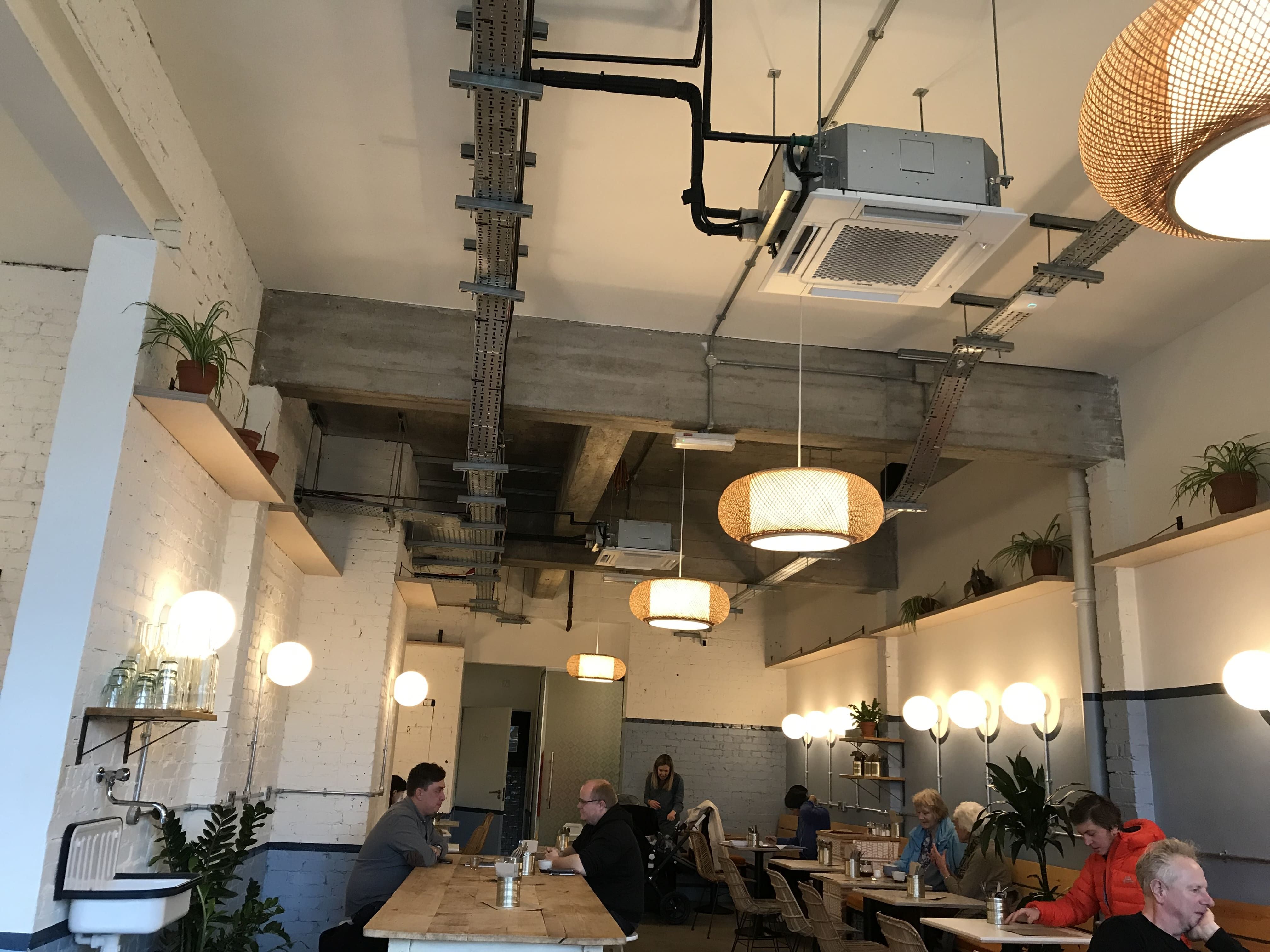 Image may contain: Flooring, Construction Crane, Cafe, Plywood, Cafeteria, Wood, Person, Human, Restaurant