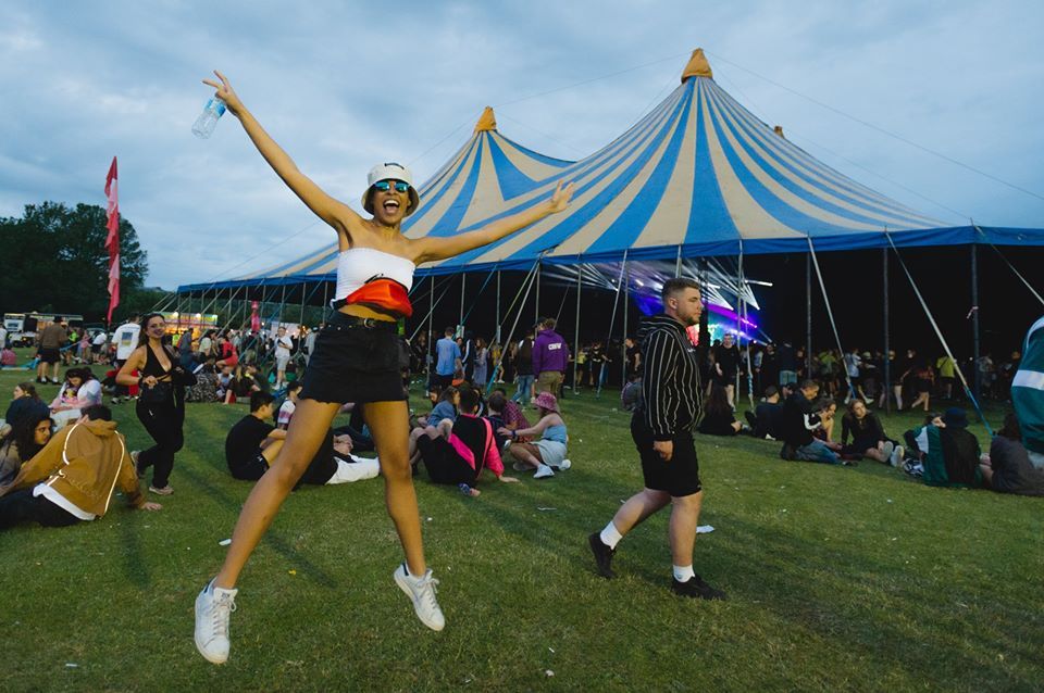 Image may contain: Girl, People, Leisure Activities, Woman, Shorts, Tent, Festival, Crowd, Female, Clothing, Apparel, Person, Human