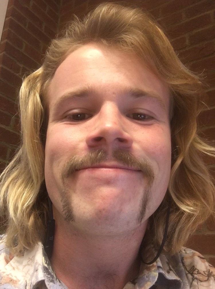 Image may contain: Mustache, Face, Person, Human