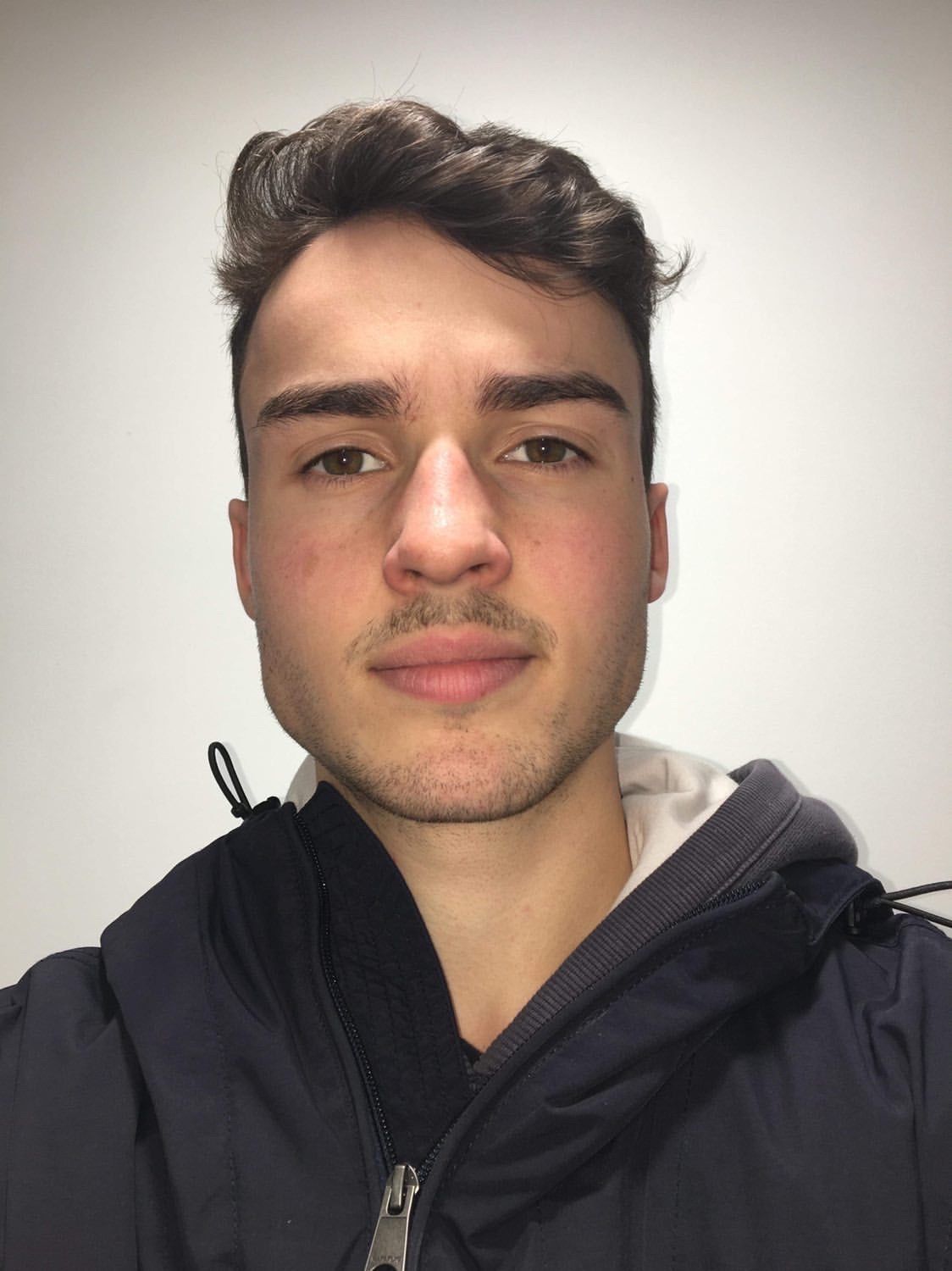 Image may contain: Mustache, Photo, Photography, Portrait, Man, Face, Jacket, Clothing, Apparel, Coat, Person, Human