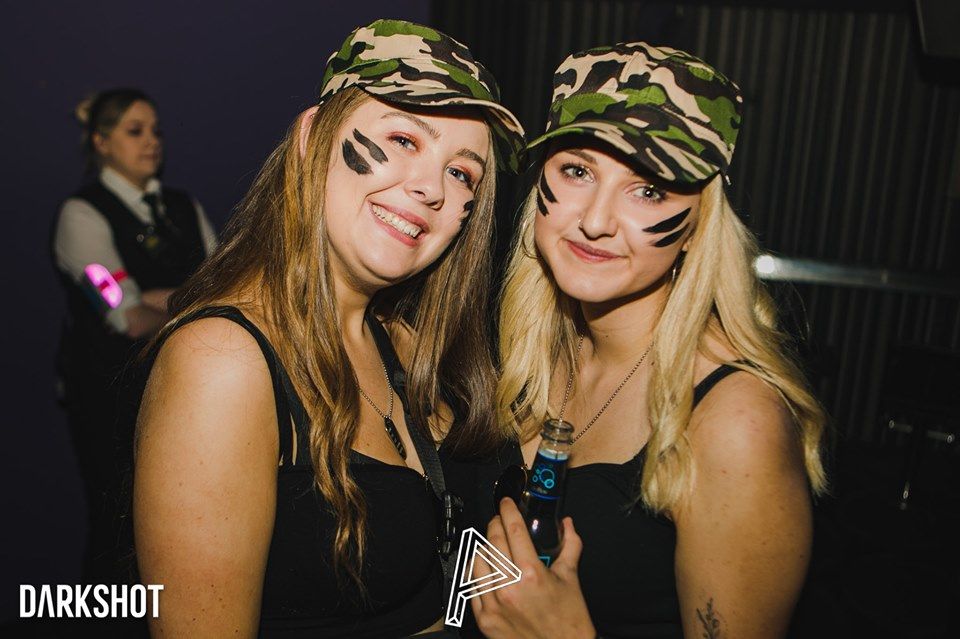 Image may contain: Night Life, Party, Club, Skin, Apparel, Hat, Clothing, Person, Human