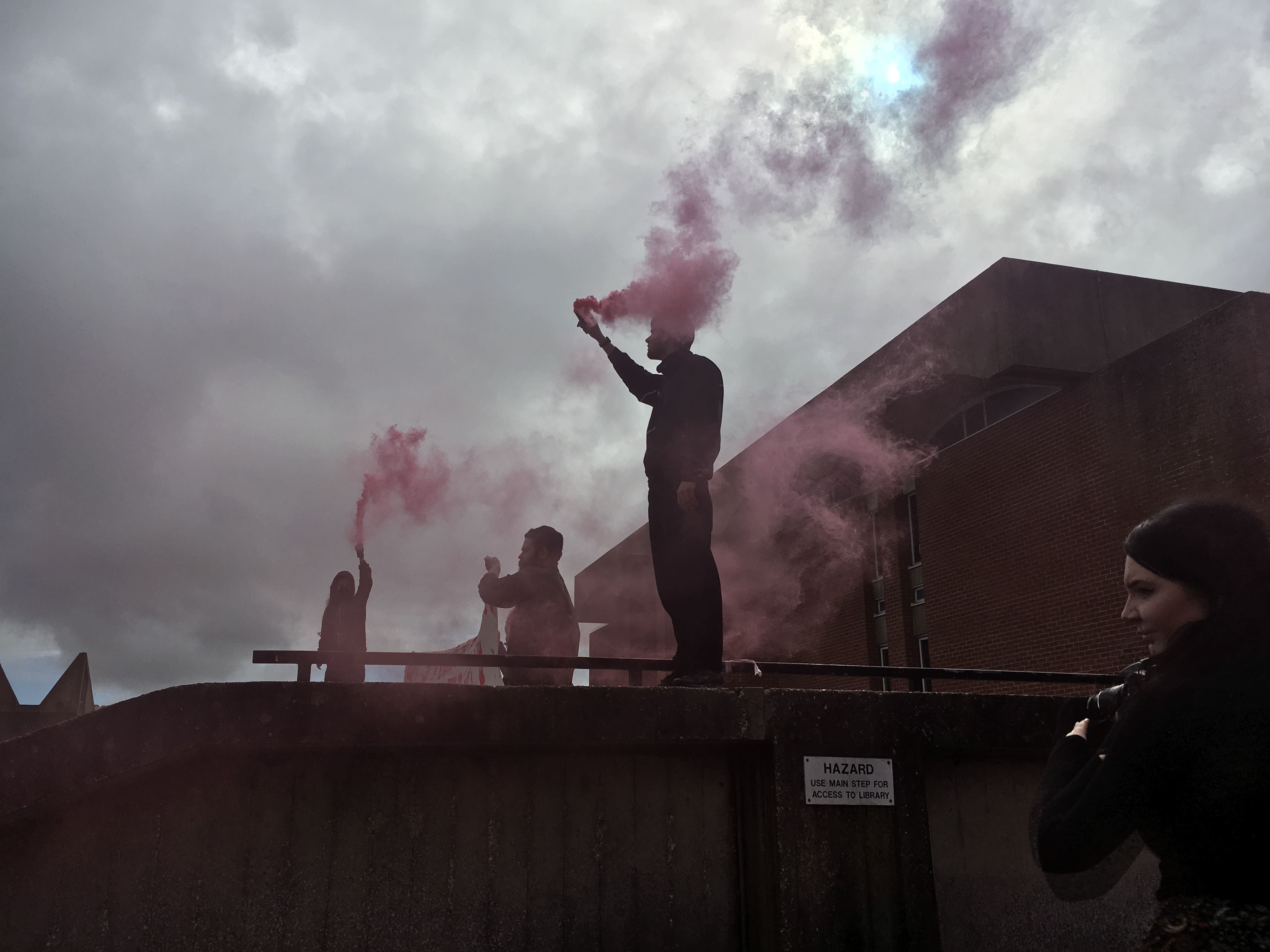 Image may contain: Smoke, Nature, Weather, Crowd, Human, Person