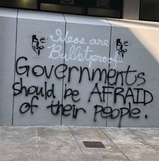 Image may contain: Text, Graffiti, Wall