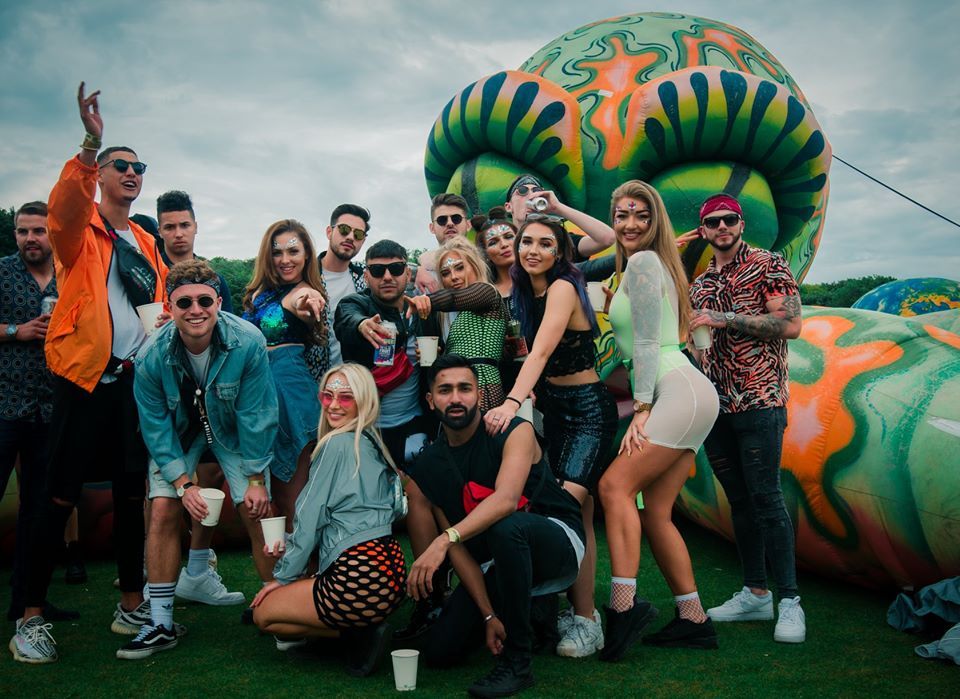 Image may contain: Woman, Girl, Shorts, Portrait, Photography, Photo, Coat, People, Grass, Plant, Female, Crowd, Accessory, Accessories, Sunglasses, Face, Costume, Shoe, Footwear, Person, Human, Apparel, Clothing