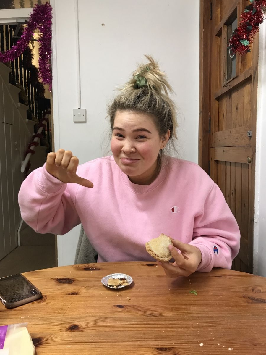 Image may contain: Finger, Eating, Food, Wood, Person, Human