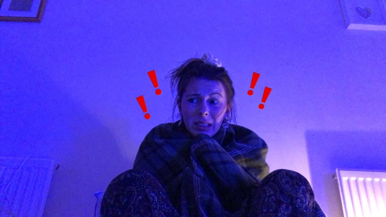 Image may contain: Blanket, Face, Purple, Clothing, Apparel, Person, Human
