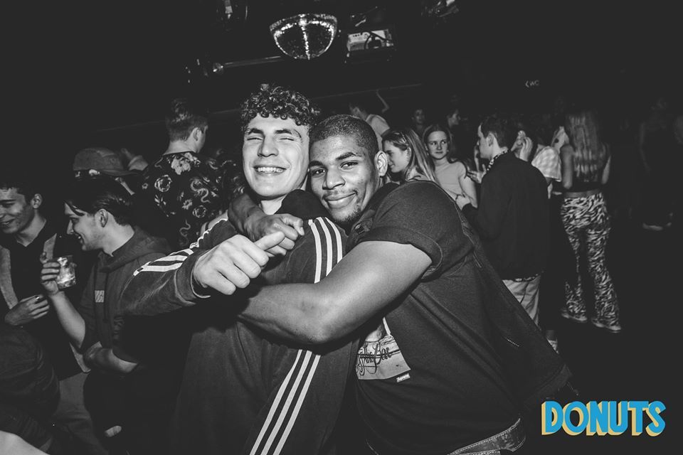 Image may contain: Crowd, Night Club, Apparel, Clothing, Club, Face, Party, Human, Person